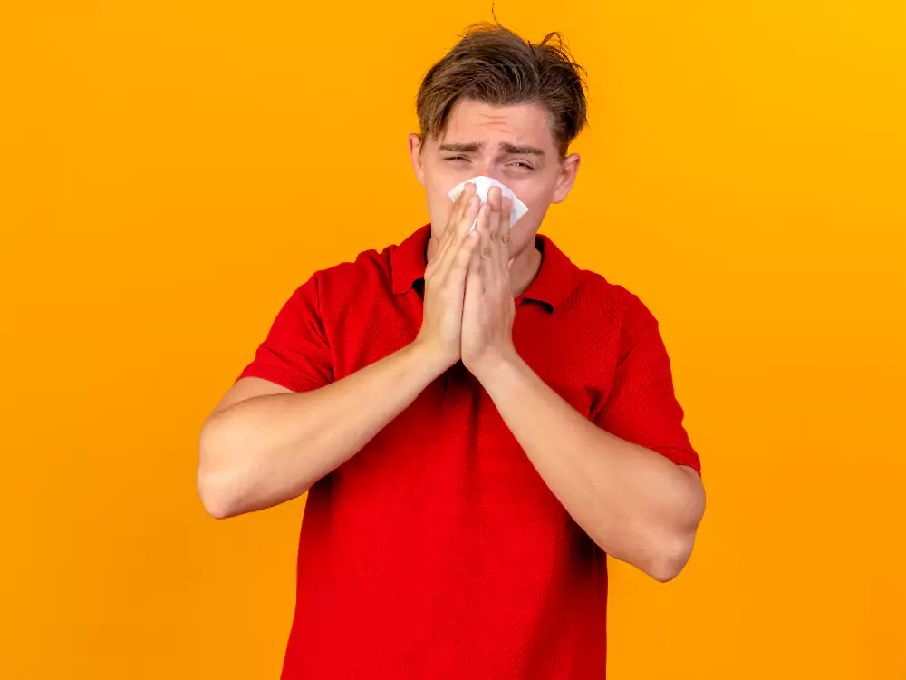 Ill Man Wiping Nose With Napkin