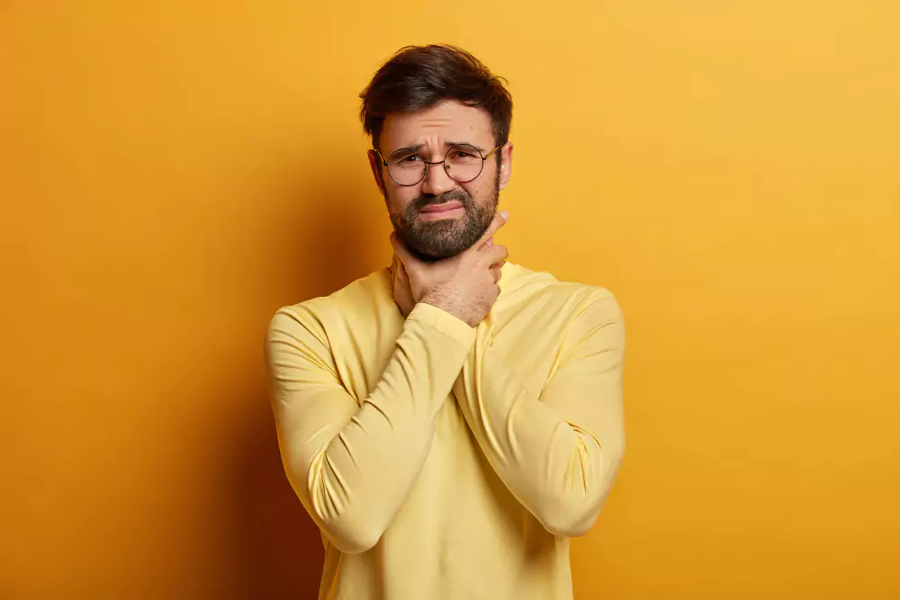 Man Yellow Shirt Showing Sign Sore Throat