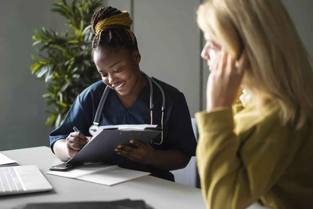 Medium Shot Smiley Nurse Clinic