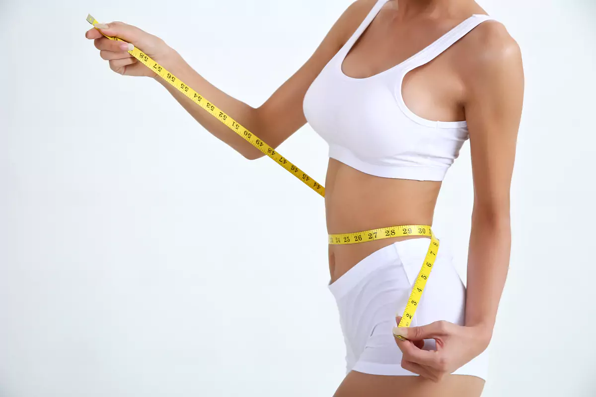 Young Woman with Measure Tape